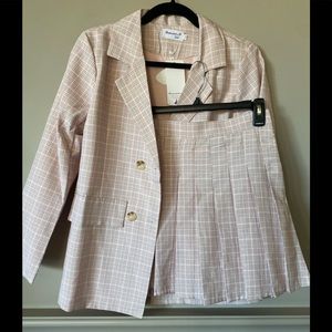 Pink plaid suit jacket and matching pleated skirt